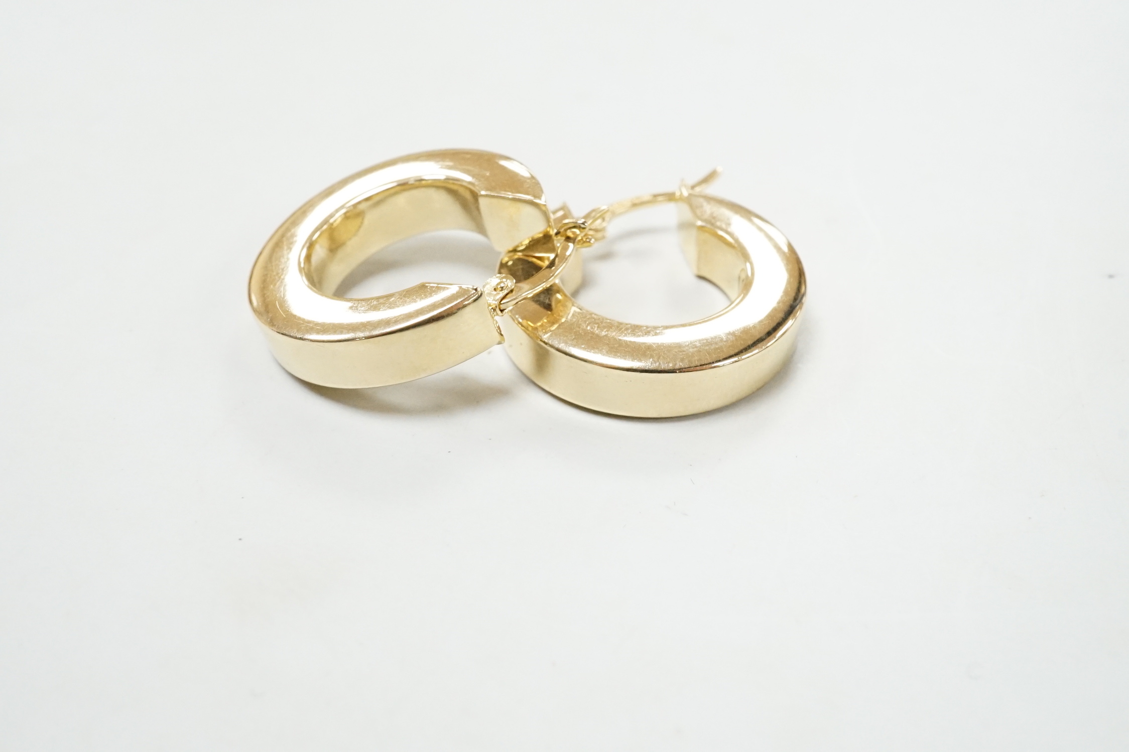 A pair of modern 14k yellow metal hoop earrings, 20mm, 5.8 grams.